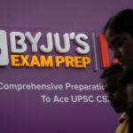 People Walk Past An Advertising Hoarding Of Byju’s, An Education Technology Company And One Of India’s Biggest Startup, Outside One Of Its Branch In New Delhi